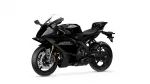 Black sport motorcycle shown from a side-front angle with aerodynamic fairings and large front brake discs, on a white background.