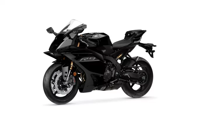 Black sport motorcycle shown from a side-front angle with aerodynamic fairings and large front brake discs, on a white background.
