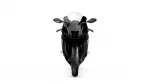 Front view of a black sport motorcycle with a clear windshield and prominent front tire, isolated on white background